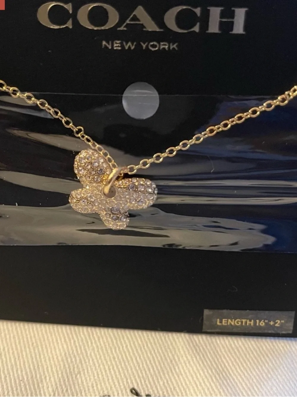 Coach gold tone